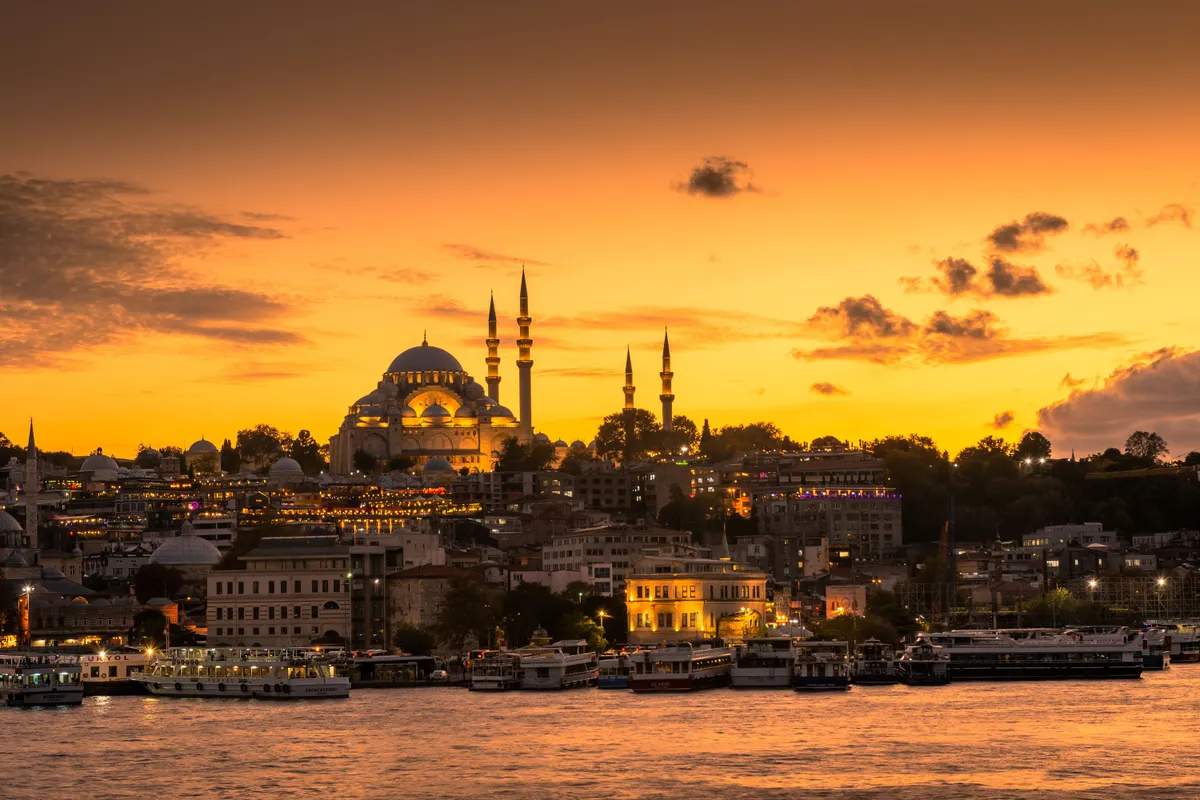 Amazing skyline of Istanbul at sunset with Suleymaniye Mosque lighten up, Turkey