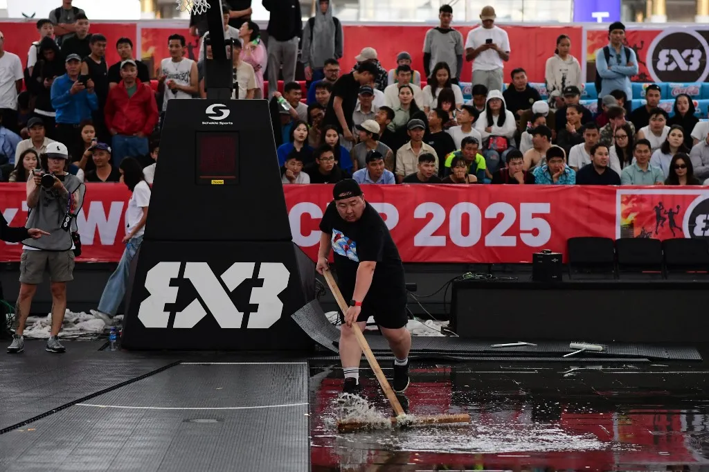 magyar Matches are temporarily cancelled due to heavy rain during the FIBA Womens 3x3 World Cup 2025 at Sukhbaatar Square in Ulaanbaatar, Mongolia on June 23, 2025. (Photo by Altan Gocher / Hans Lucas via AFP)