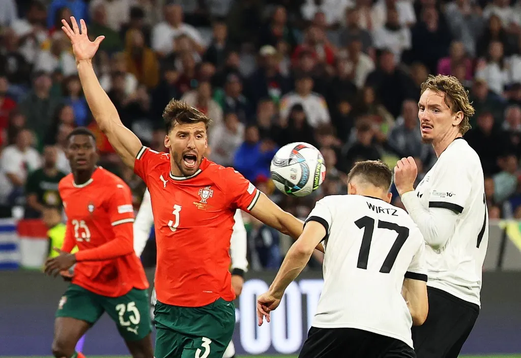 04 June 2025, Bavaria, Munich: Soccer: Nations League A, Germany - Portugal, play-off round, semi-final, Football Arena Munich, Germany's Florian Wirtz (front) scores the goal to make it 1:0 against Portugal's Ruben Dias (center l). On the right Germany's Nick Woltemade. Photo: Christian Charisius/dpa (Photo by CHRISTIAN CHARISIUS / dpa Picture-Alliance via AFP)
