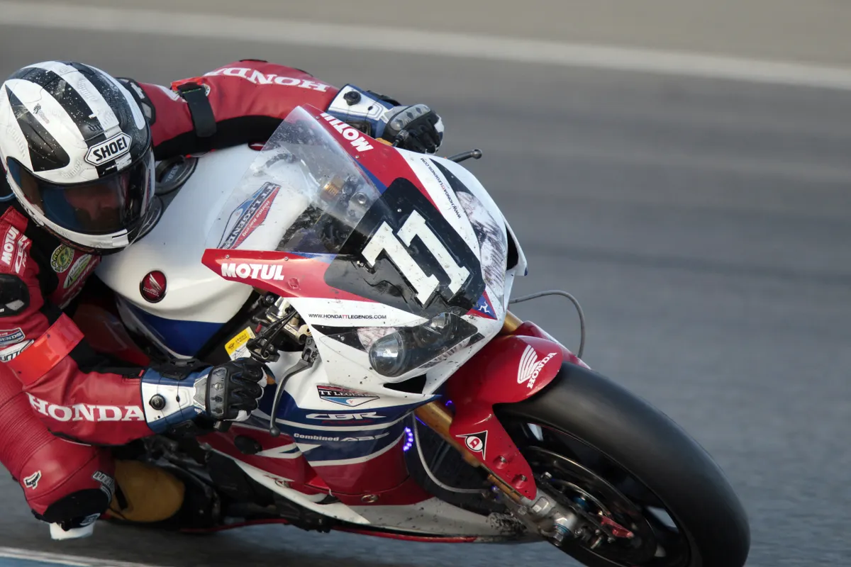 England's Michael Dunlop rides his Honda CBR RR 1000 during the 36th edition of the 24-hour Le Mans endurance race in Le Mans, western France, on September 21, 2013. AFP PHOTO/CHARLY TRIBALLEAU (Photo by CHARLY TRIBALLEAU / AFP), Brad Pitt