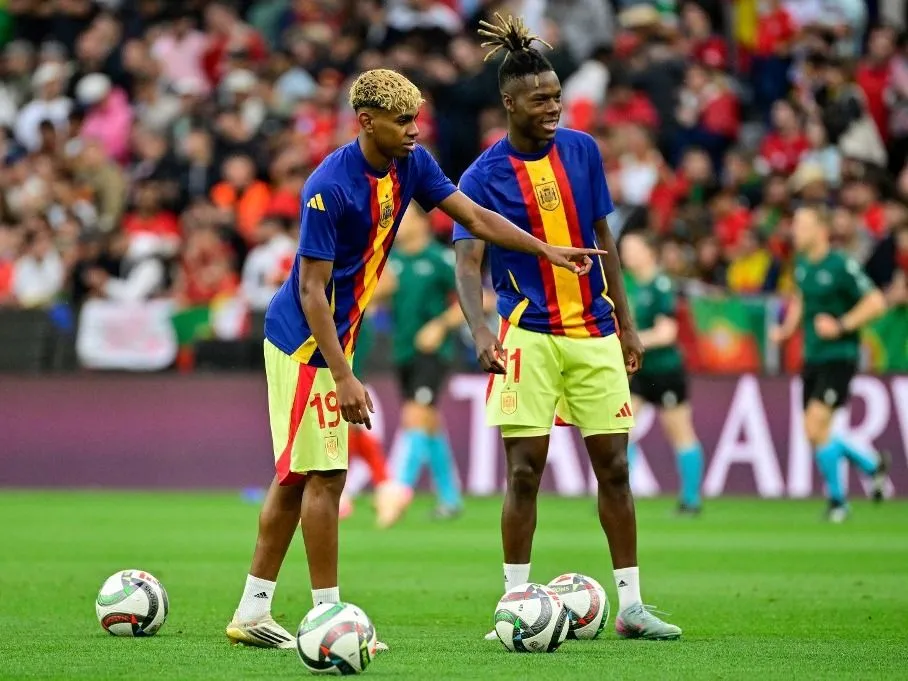 Yamal, Lamine Yamal (L) and Spain's forward #11 Nico Williams practice shooting during the warm up prior to the UEFA Nations League final football match between Portugal and Spain in Munich, southern Germany on June 8, 2025. (Photo by John MACDOUGALL / AFP)