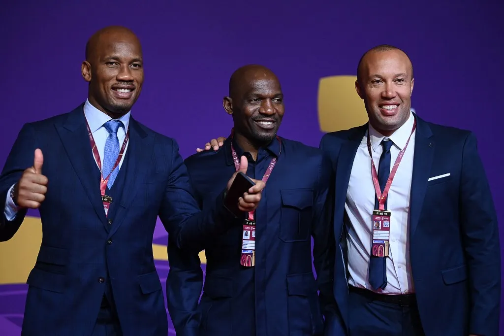 Chelsea Real Madrid (L-R) Former Ivorian footballer Didier Drogba, former Cameroonian footballer Geremi and former French footballer Mikael Silvestre arrive for the draw for the 2022 World Cup in Qatar at the Doha Exhibition and Convention Center on April 1, 2022. (Photo by FRANCK FIFE / AFP)
