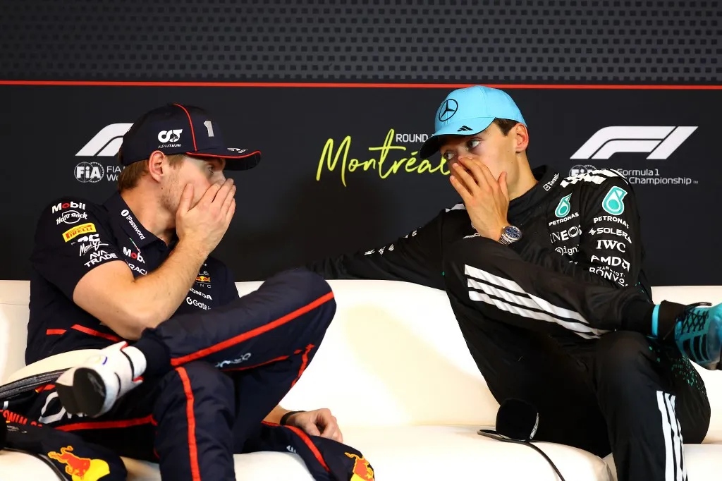 MONTREAL, QUEBEC - JUNE 15: Race winner George Russell of Great Britain and Mercedes AMG Petronas F1 Team and Second placed Max Verstappen of the Netherlands and Oracle Red Bull Racing talk in the Drivers Press Conference during the F1 Grand Prix of Canada at Circuit Gilles-Villeneuve on June 15, 2025 in Montreal, Quebec.   Clive Rose/Getty Images/AFP (Photo by CLIVE ROSE / GETTY IMAGES NORTH AMERICA / Getty Images via AFP)