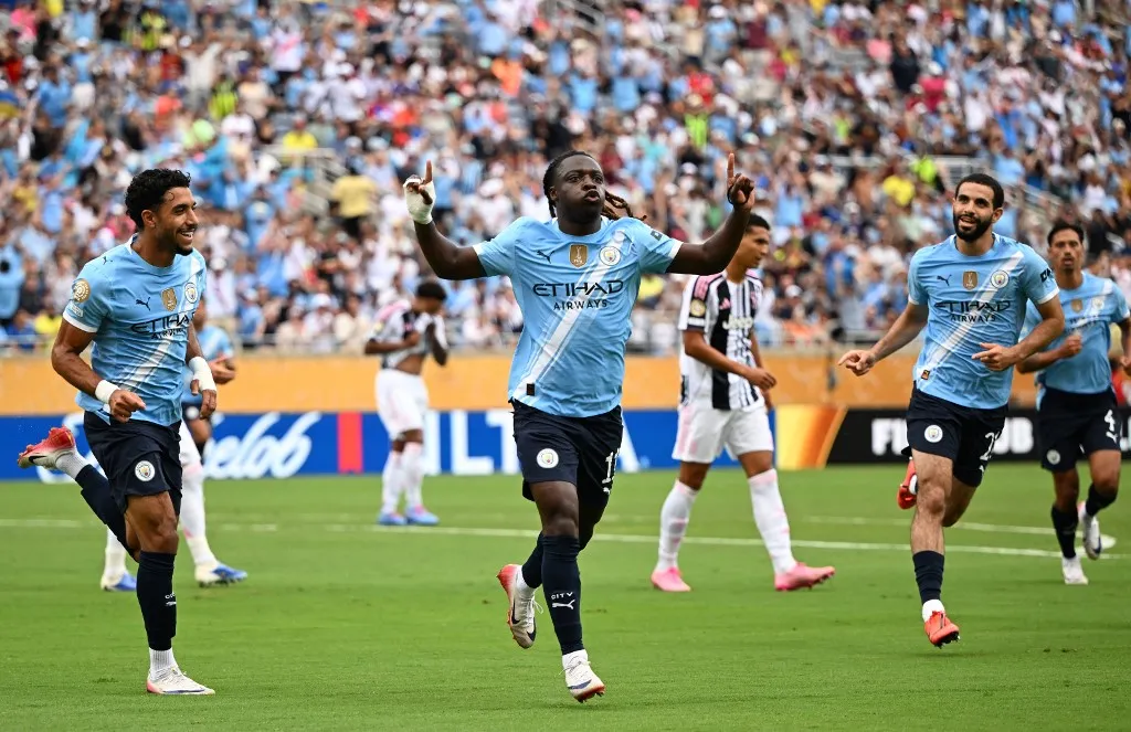 Manchester City's Belgian midfielder #11 Jeremy Doku celebrates scoring the opening goal during the FIFA Club World Cup 2025 Group D football match between US Los Angeles FC and Brazil's CR Flamengo at the Camping World stadium in Orlando on June 24, 2025. (Photo by PATRICIA DE MELO MOREIRA / AFP)