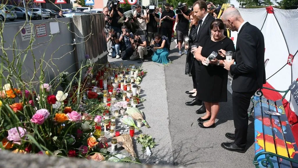 GRAZ, AUSTRIA - JUNE 11: People stand in silence in memory of those who lost their lives at the high school shooting in Graz, in Graz, Austria on June 11, 2025. Askin Kiyagan / Anadolu (Photo by Askin Kiyagan / Anadolu via AFP)