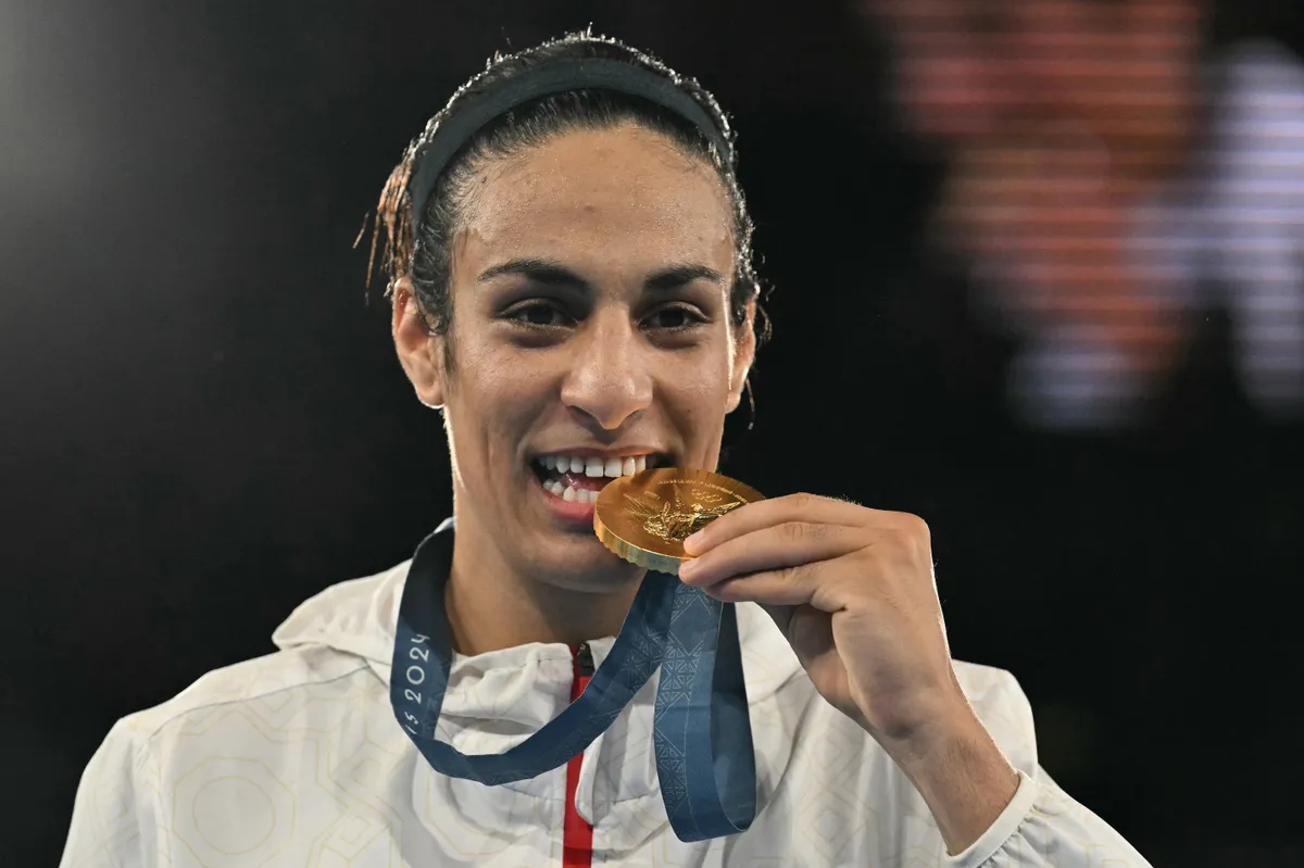 Imane Helif, (FILES) Gold medallist Algeria's Imane Khelif poses on the podium during the medal ceremony for the women's 66kg final boxing category during the Paris 2024 Olympic Games at the Roland-Garros Stadium, in Paris on August 9, 2024. Algerian Olympic champion boxer Imane Khelif, who is at the centre of a row over gender eligibility, will not compete in this week's tournament in The Netherlands, organisers said on June 5, 2025. (Photo by MOHD RASFAN / AFP)