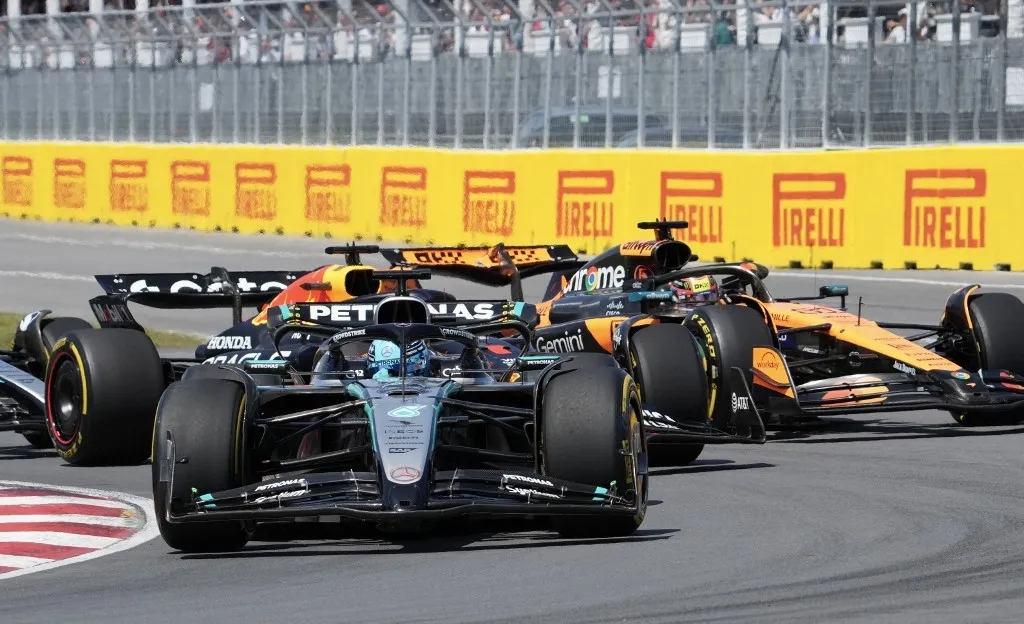 Mercedes' British driver George Russell leads the pack at the start of the race during the 2025 Formula 1 Grand Prix du Canada at Circuit Gilles-Villeneuve in Montreal, Canada, on June 15, 2025. (Photo by TIMOTHY A. CLARY / AFP)