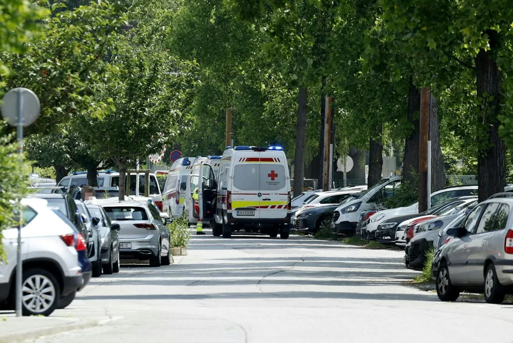 Ambulance cars are seen in a street close to a school where, according to reports, several people died in a shooting, on June 10, 2025 in Graz, southeastern Austria. Several people died in a school shooting, including the attacker, Austrian broadcaster ORF quoted the interior ministry as saying. (Photo by ERWIN SCHERIAU / APA / AFP) / Austria OUT