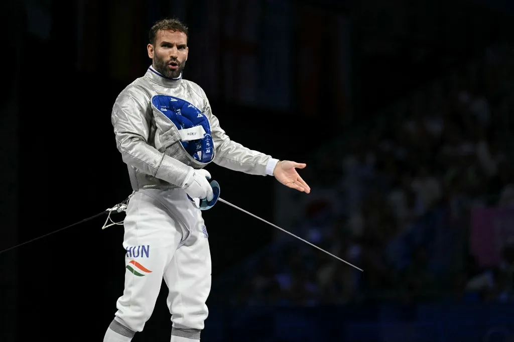 Szilágyi Áron Hungary's Aron Szilagyi reacts in the men's sabre team gold medal bout between Hungary and South Korea during the Paris 2024 Olympic Games at the Grand Palais in Paris, on July 31, 2024. (Photo by Fabrice COFFRINI / AFP)