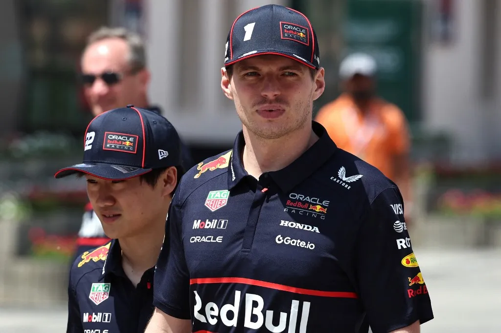 Red Bull Racing's Dutch driver Max Verstappen and Red Bull Racing's Japanese driver Yuki Tsunoda arrive at the circuit ahead of the third practice session ahead of the Bahrain Formula One Grand Prix at the Bahrain International Circuit in Sakhir on April 12, 2025. (Photo by Fadel SENNA / AFP)