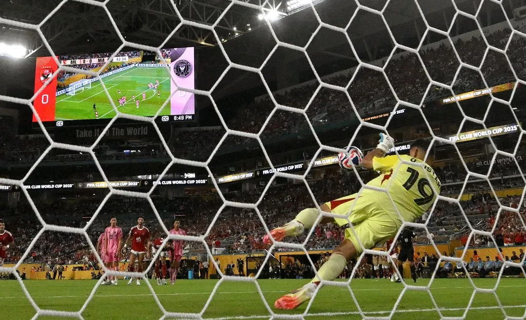 Inter Miami's Argentine goalkeeper #19 Oscar Ustari makes a save on the penlaty kick by Al Ahly's Egyptian midfielder #07 Trezeguet during the Club World Cup 2025 Group A football match between Egypt's Al-Ahly and US Inter Miami at the Hard Rock stadium in Miami on June 14, 2025. (Photo by PATRICIA DE MELO MOREIRA / AFP)