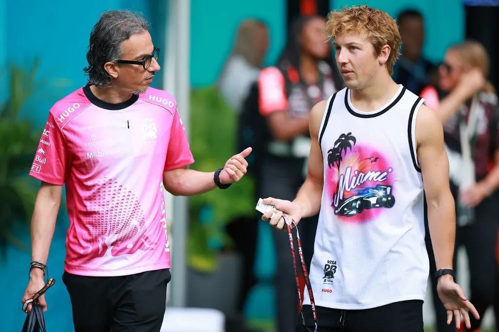 MIAMI, FLORIDA - MAY 03: Laurent Mekies, Team Principal of Visa Cash App Racing Bulls and Liam Lawson of New Zealand and Visa Cash App Racing Bulls arrive in the Paddock prior to the Sprint ahead of the F1 Grand Prix of Miami at Miami International Autodrome on May 03, 2025 in Miami, Florida.   Hector Vivas/Getty Images/AFP (Photo by Hector Vivas / GETTY IMAGES NORTH AMERICA / Getty Images via AFP)