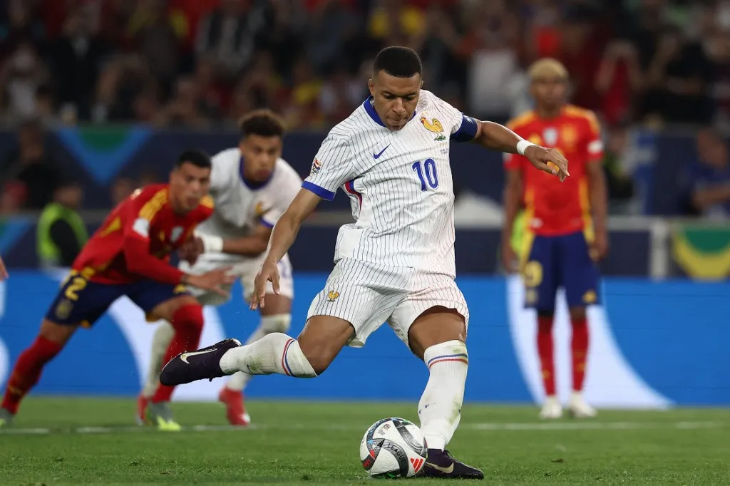 France's forward #10 Kylian Mbappe scores the 1-4 goal from the penalty spot during the UEFA Nations League semi-final football match between Spain and France in Stuttgart, southwestern Germany, on June 5, 2025. (Photo by FRANCK FIFE / AFP)