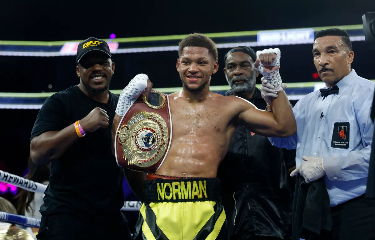 LAS VEGAS, NEVADA - NOVEMBER 16: Brian Norman Jr. (C) poses with referee Tony Weeks (R) after defeating Quinton Randall in a welterweight bout on November 16, 2023 in Las Vegas, Nevada.   Steve Marcus/Getty Images/AFP (Photo by Steve Marcus / GETTY IMAGES NORTH AMERICA / Getty Images via AFP)