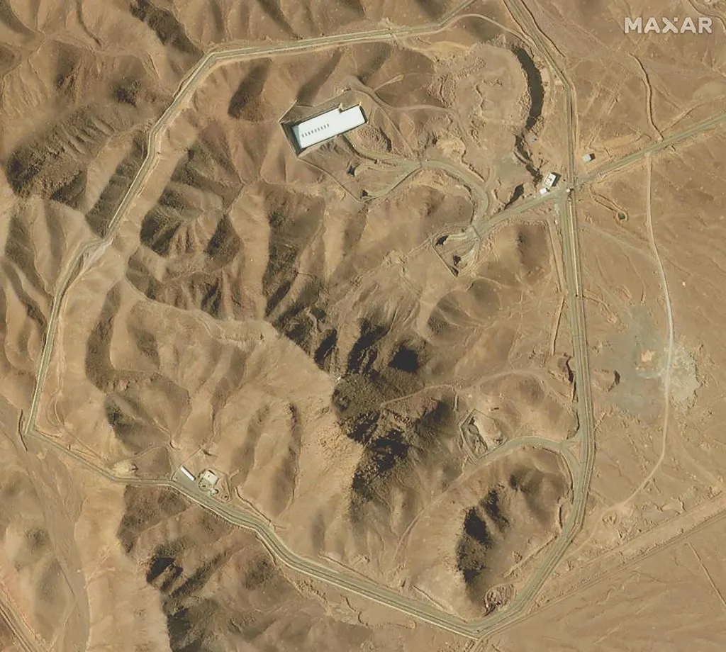This handout satellite image provided by Maxar Technologies and taken on February 12, 2025 shows an overview of the Fordo (Fordow) uranium enrichment facility, south of the capital Tehran. Iranian authorities said on June 13, 2025 that nuclear sites at Fordow and Isfahan have not been hit in Israel strikes, according to the head of the International Atomic Energy Agency. Israel pounded Iran in a series of air raids early in the morning, striking 100 targets including Tehran's nuclear and military sites, and killing the armed forces' chief of staff, the head of Iran's Revolutionary Guards and top nuclear scientists. (Photo by Satellite image ©2021 Maxar Technologies / AFP) / RESTRICTED TO EDITORIAL USE - MANDATORY CREDIT "AFP PHOTO / Satellite image ©2021 Maxar Technologies " - NO MARKETING - NO ADVERTISING CAMPAIGNS - DISTRIBUTED AS A SERVICE TO CLIENTS - The watermark may not be removed/cropped / THE WATERMARK MAY NOT BE REMOVED/CROPPED