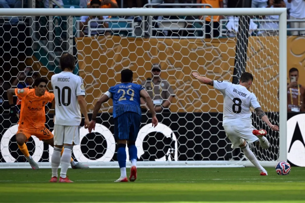 Real Madrid's Uruguayan midfielder #08 Federico Valverde (R) shoots on his way to miss a penalty kick during the FIFA Club World Cup 2025 Group H football match between Spain's Real Madrid and Saudi's Al-Hilal at the Hard Rock stadium in Miami on June 18, 2025. (Photo by CHANDAN KHANNA / AFP)