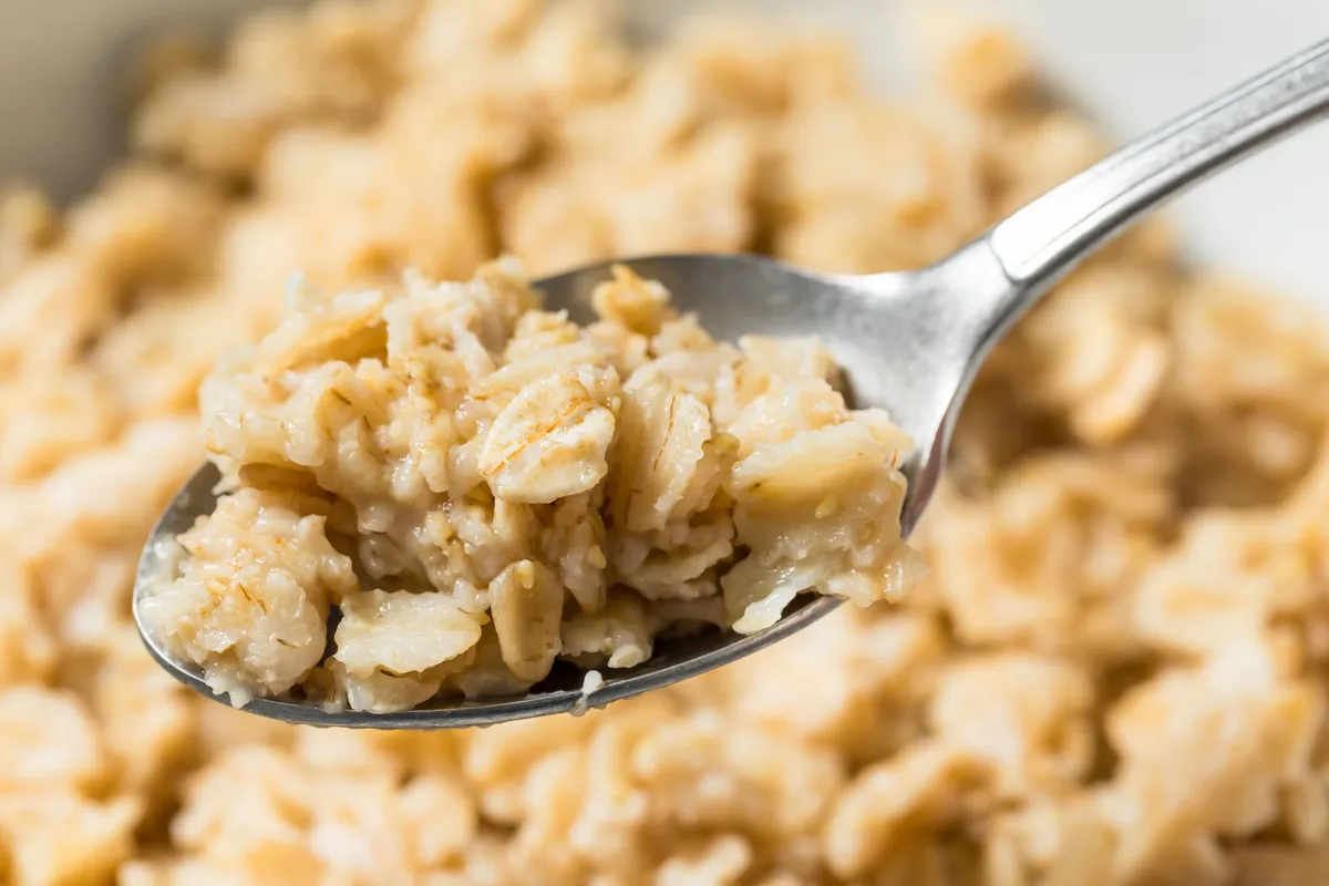 Basic Homemade Rolled Oats Oatmeal in a Bowl for Breakfast