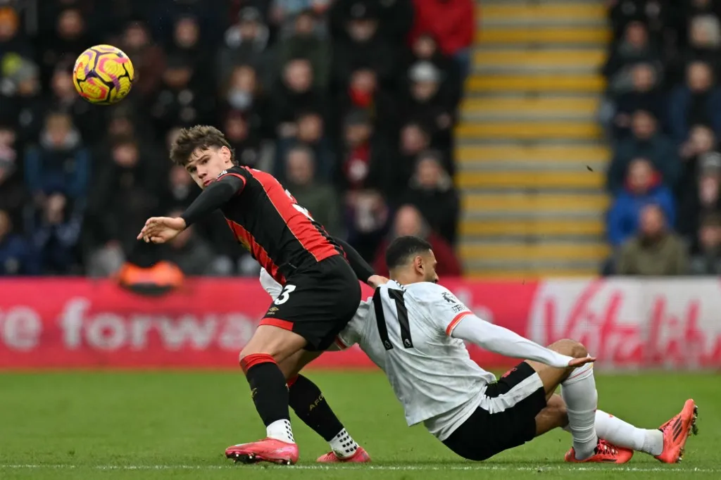 Bournemouth's Hungarian defender #03 Milos Kerkez (L) vies with Liverpool's Egyptian striker #11 Mohamed Salah (R) during the English Premier League football match between Bournemouth and Liverpool at the Vitality Stadium in Bournemouth, southern England on February 1, 2025. (Photo by Glyn KIRK / AFP) / RESTRICTED TO EDITORIAL USE. No use with unauthorized audio, video, data, fixture lists, club/league logos or 'live' services. Online in-match use limited to 120 images. An additional 40 images may be used in extra time. No video emulation. Social media in-match use limited to 120 images. An additional 40 images may be used in extra time. No use in betting publications, games or single club/league/player publications. / 