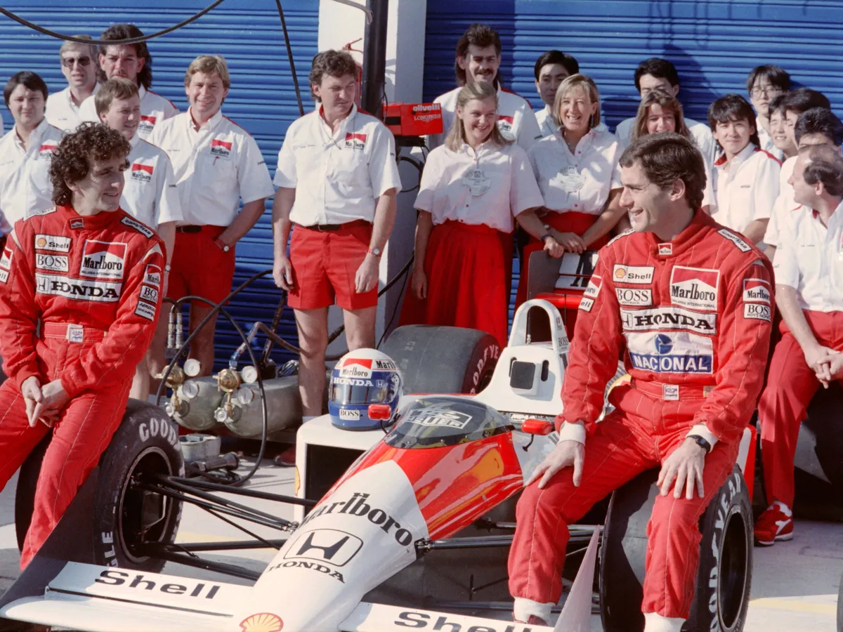 Alain Prost of France (L) and Brazilian Ayrton Senna look each other as they are posing for photograhers on October 2, 1988 before the first practice session of the F1 Spanish Grand Prix in Jerez. (Photo by AFP)