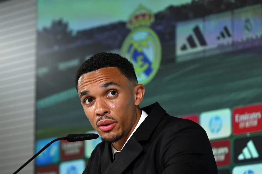 English defender Trent Alexander-Arnold gives a press conference during his official presentation as a new Real Madrid CF player, at the Ciudad Real Madrid training complex in Valdebebas, on the outskirts of Madrid, on June 12, 2025. Trent Alexander-Arnold said at his Real Madrid presentation today he feels a "big responsibility" to deliver for his new club. The right-back, who signed from Liverpool for a fee to speed up his arrival ahead of the Club World Cup, surprised as he gave a short speech in Spanish. "Signing for a club like Real Madrid does not happen every day. It's a dream come true," Alexander-Arnold told reporters. (Photo by JAVIER SORIANO / AFP)