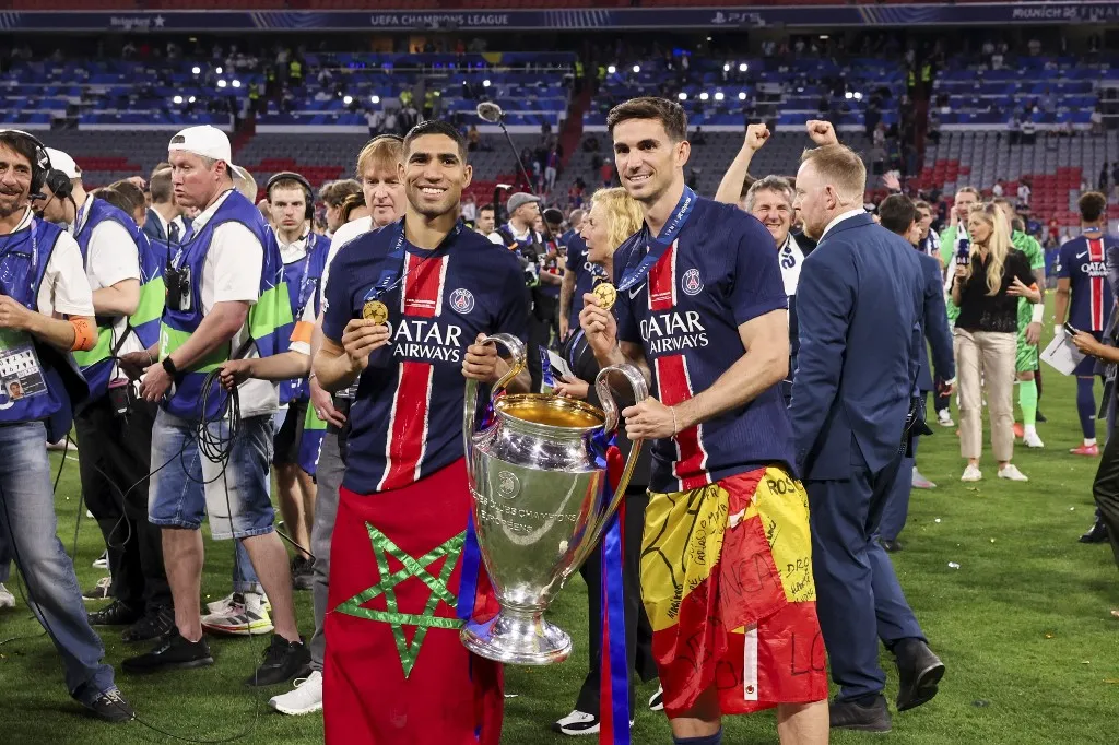 PSG, MUNICH, GERMANY - MAY 31: Achraf Hakimi #2 of Paris Saint-Germain and Fabian Ruiz Pena #8 of Paris Saint-Germain celebrate PSGOs victory of the UEFA Champions League Final 2025 between Paris Saint-Germain and FC Internazionale Milano at Munich Football Arena on May 31, 2025 in Munich, Germany. (Photo by Catherine Steenkeste/Hans Lucas) (Photo by Catherine Steenkeste / Hans Lucas / Hans Lucas via AFP)