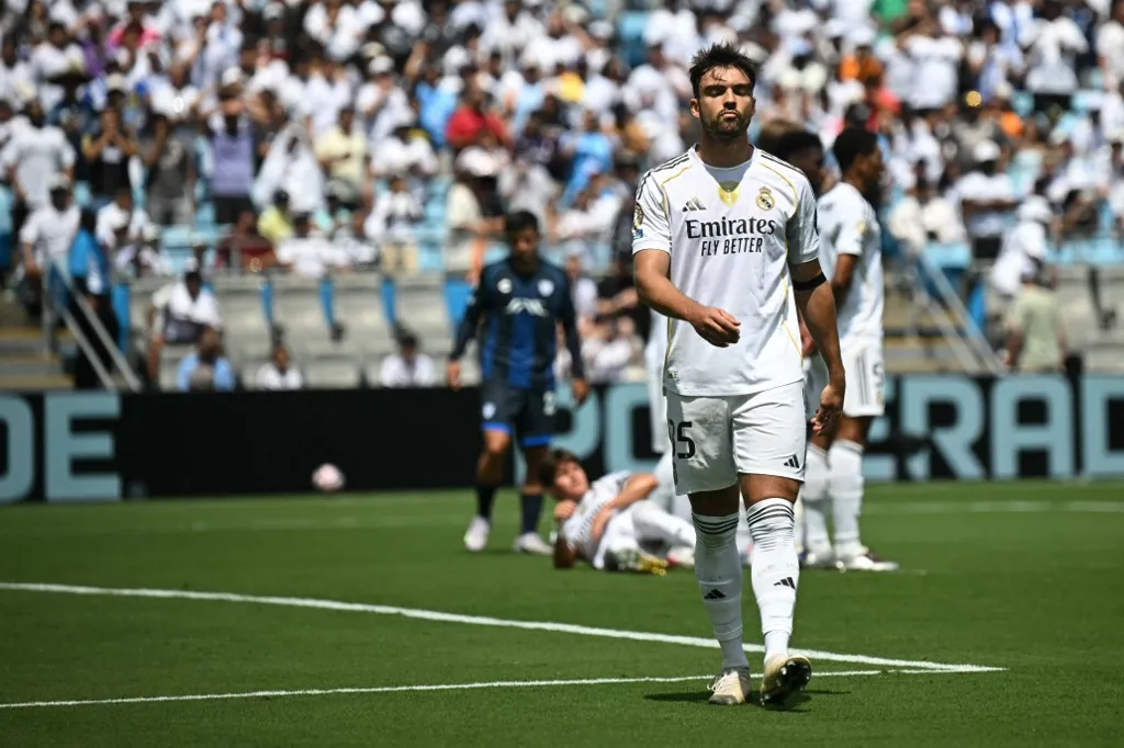 Real Madrid's Spanish defender #35 Raul Asencio leaves the pitch after being shown a red card during the FIFA Club World Cup 2025 Group H football match between Spain's Real Madrid and Mexico's Pachuca at the Bank of America stadium in Charlotte on June 22, 2025. (Photo by Paul ELLIS / AFP)