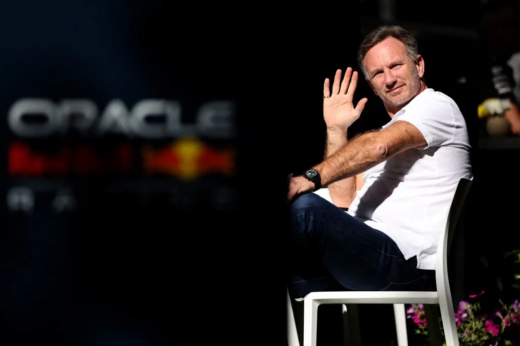 (FILES) Red Bull Racing team principal Christian Horner waves at the Albert Park Circuit ahead of the Formula One Australian Grand Prix in Melbourne on March 21, 2024. Christian Horner is to leave his role as Red Bull team principal with immediate effect after 20 years, the Formula One team announced on July 9, 2025. (Photo by Martin KEEP / AFP) / -- IMAGE RESTRICTED TO EDITORIAL USE - STRICTLY NO COMMERCIAL USE --