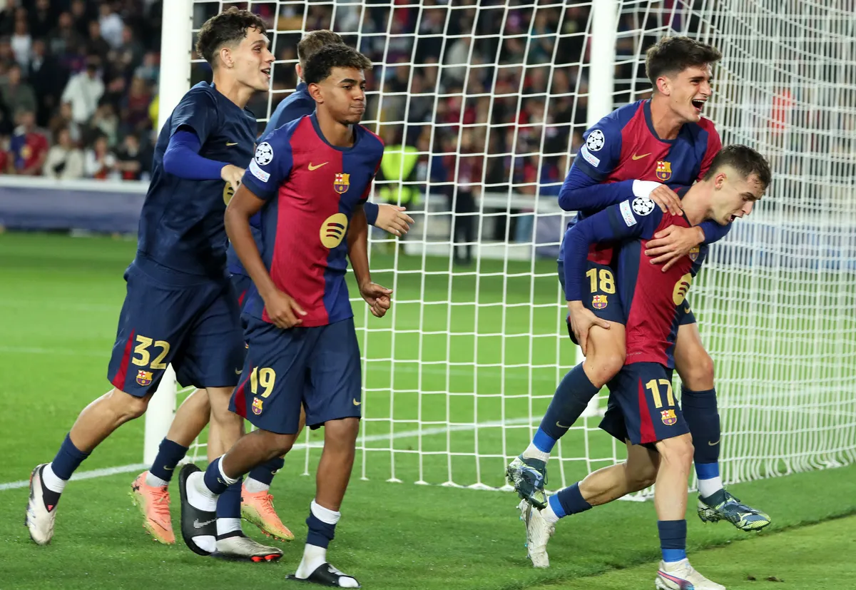 Marc Casado, Pau Victor, and Lamine Yamal celebrate at the end of the match between FC Barcelona and FC Bayern Munich, corresponding to week 3 of the League Stage of the UEFA Champions League, played at the Lluis Companys Stadium in Barcelona, Spain, on October 23, 2024. (Photo by Joan Valls/Urbanandsport/NurPhoto) (Photo by Urbanandsport/NurPhoto) (Photo by Urbanandsport / NurPhoto via AFP)