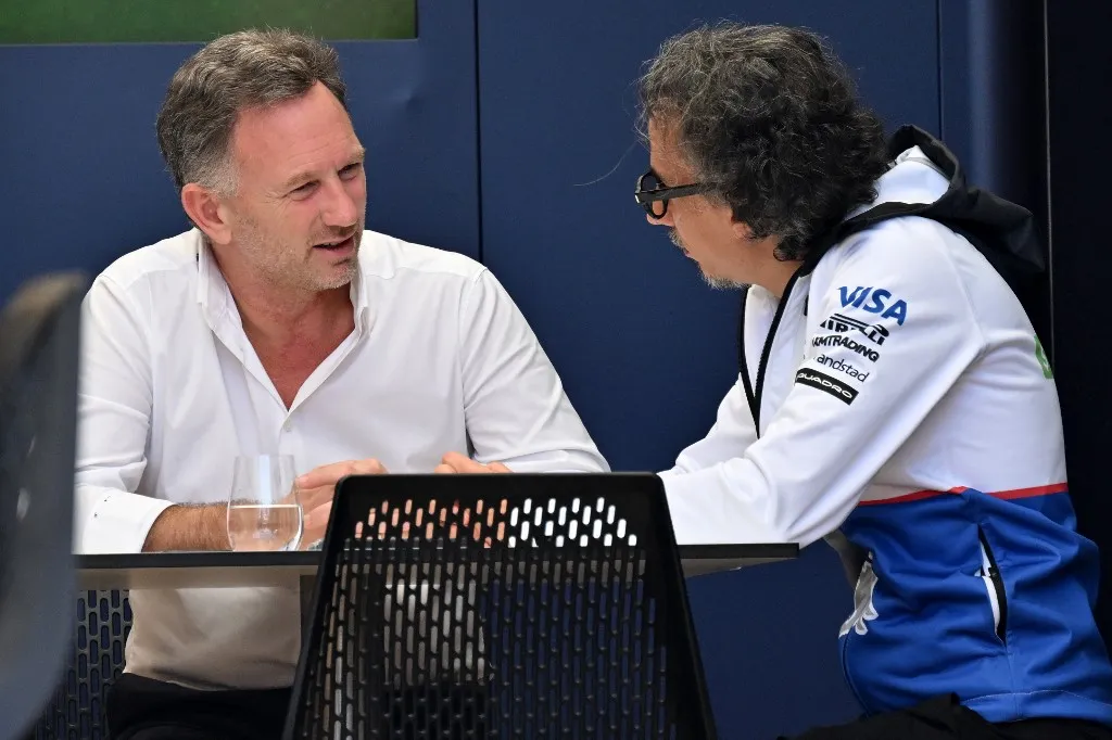 Red Bull Racing's team principal Christian Horner (L) talks to Racing Bull's team principal Laurent Mekies during the second day of the Formula One pre-season testing at the Bahrain International Circuit in Sakhir on February 22, 2024. (Photo by Andrej ISAKOVIC / AFP)