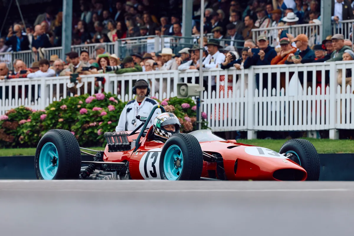 A driver sits in a classic Ferrari sports car on the second day of the Goodwood Revival meeting 2024, north of Chichester in southern England on September 7, 2024. (Photo by BENJAMIN CREMEL / AFP) / RESTRICTED TO EDITORIAL USE, Red Bull