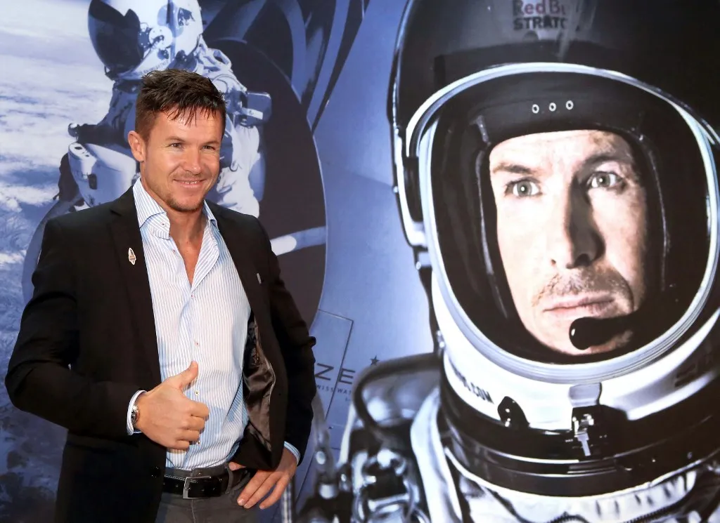 Austrian sky diver and base jumper Felix Baumgartner poses for a photo during a conference in Kuwait City on December 11, 2013 during his visit to Kuwait to meet fans and answer questions about his career and his record-breaking freefall last year. In October 2012, Baumgartner jumped out of a balloon from 128,000 feet above New Mexico, breaking the record for the highest ever freefall, and was the first skydiver to break the sound barrier. AFP PHOTO / YASSER AL-ZAYYAT (Photo by YASSER AL-ZAYYAT / AFP)
