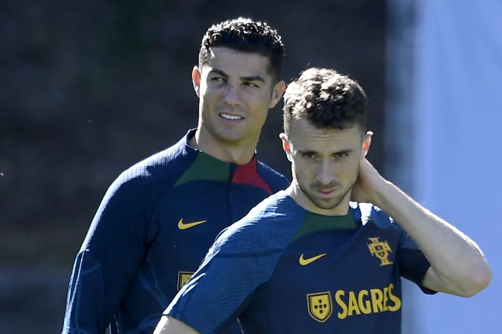 Portugal national team's players Portugal's forward Cristiano Ronaldo (L) and Portugal's forward Diogo Jota attend a training session on the eve of the UEFA Nations League football match between Portugal and Spain, at the Municipal Stadium in Braga on September 26, 2022. Liverpool striker Diogo Jota died along with his brother early July 3, 2025 in a road accident in northwest Spain, the Spanish Civil Guard said. The accident occurred around 12:30 a.m. on a highway in the province of Zamora. The vehicle "left the road" before bursting into flames, the Civil Guard said, adding that the two passengers, Diogo Jota and his brother Andre Felipe, also a professional footballer, were deceased. (Photo by MIGUEL RIOPA / AFP)