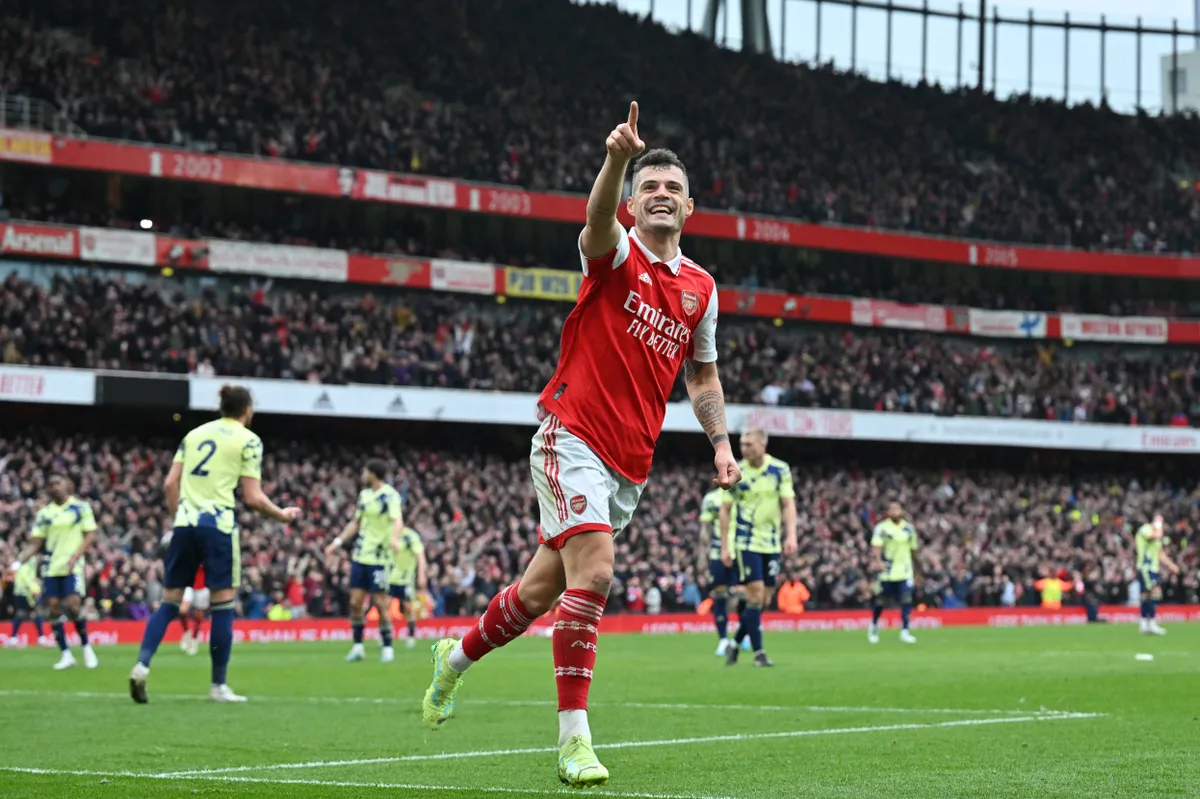 Arsenal's Swiss midfielder Granit Xhaka celebrates after scoring their fourth goal during the English Premier League football match between Arsenal and Leeds United at the Emirates Stadium in London on April 1, 2023. (Photo by Glyn KIRK / AFP) / RESTRICTED TO EDITORIAL USE. No use with unauthorized audio, video, data, fixture lists, club/league logos or 'live' services. Online in-match use limited to 120 images. An additional 40 images may be used in extra time. No video emulation. Social media in-match use limited to 120 images. An additional 40 images may be used in extra time. No use in betting publications, games or single club/league/player publications. / 