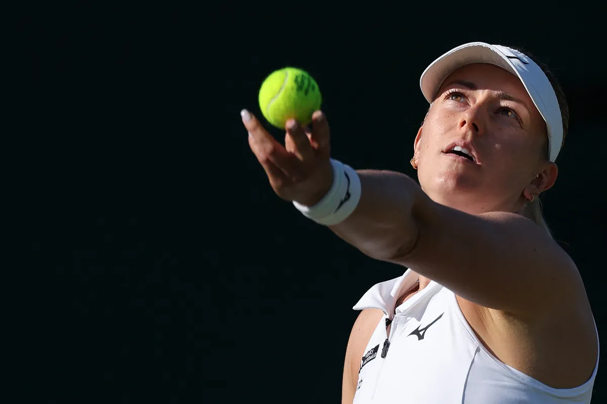 Hungary's Gálfi Dalma serves to Brazil's Beatriz Haddad Maia during their women's singles second round tennis match on the third day of the 2025 Wimbledon Championships at The All England Lawn Tennis and Croquet Club in Wimbledon, southwest London, on July 2, 2025. (Photo by Adrian Dennis / AFP) / RESTRICTED TO EDITORIAL USE