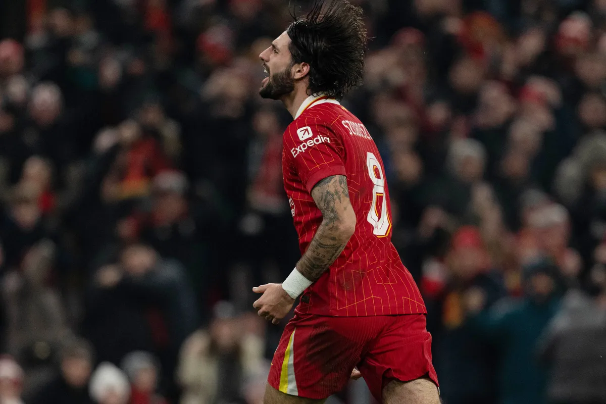 Liverpool's Dominik Szoboszlai celebrates after scoring their third goal during the Carabao Cup Semi-Final Second Leg match between Liverpool and Tottenham Hotspur at Anfield in Liverpool, England, on February 6, 2025. (Photo by Steven Halliwell | MI News/NurPhoto) (Photo by MI News / NurPhoto via AFP)