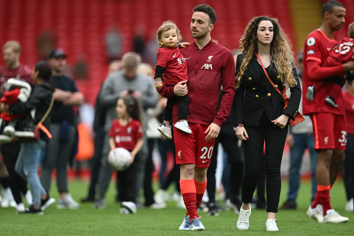 (FILES) Liverpool's Portuguese striker Diogo Jota celebrates his family during a lap of honour at the end of the English Premier League football match between Liverpool and Wolverhampton Wanderers at Anfield in Liverpool, north west England on May 22, 2022. Liverpool striker Diogo Jota died along with his brother early July 3, 2025 in a road accident in northwest Spain, the Spanish Civil Guard said. The accident occurred around 12:30 a.m. on a highway in the province of Zamora. The vehicle "left the road" before bursting into flames, the Civil Guard said, adding that the two passengers, Diogo Jota and his brother Andre Felipe, also a professional footballer, were deceased. (Photo by Paul ELLIS / AFP) / RESTRICTED TO EDITORIAL USE. No use with unauthorized audio, video, data, fixture lists, club/league logos or 'live' services. Online in-match use limited to 120 images. An additional 40 images may be used in extra time. No video emulation. Social media in-match use limited to 120 images. An additional 40 images may be used in extra time. No use in betting publications, games or single club/league/player publications. / 