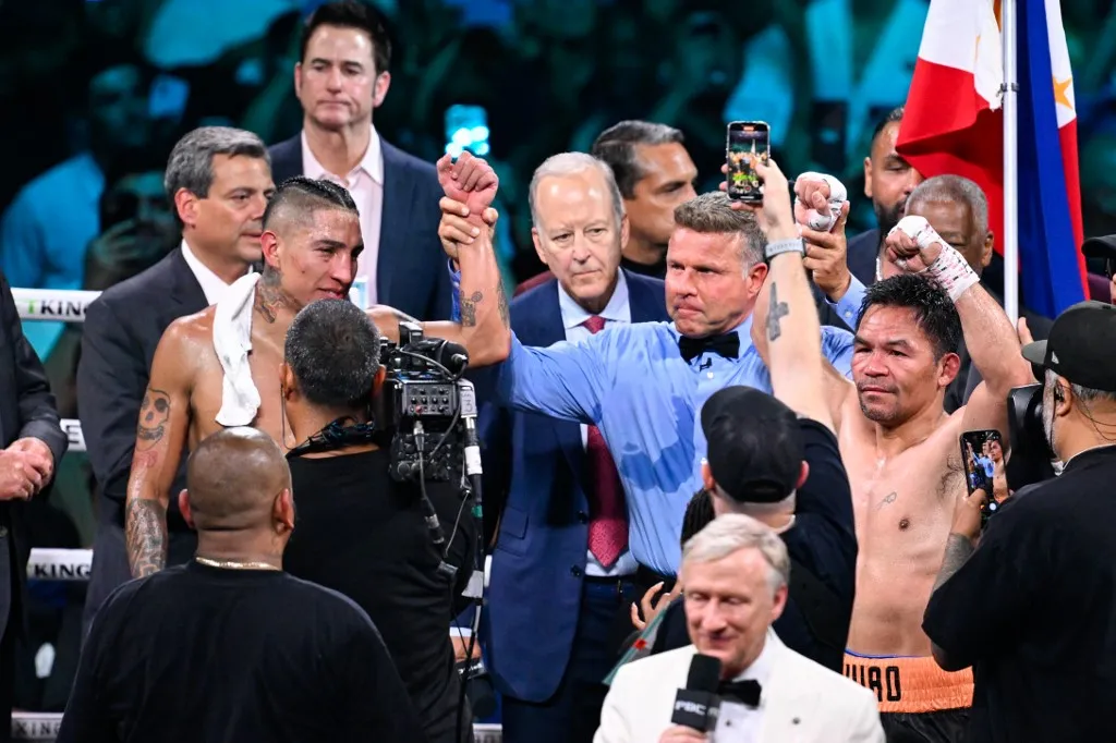 LAS VEGAS, NEVADA - JULY 19: Mario Barrios (left) and Manny Pacquiao (right) are seen during their WBC welterweight championship world titles of the Premiere Boxing Championship on Saturday night at MGM Grand Garden Arena in Las Vegas, Nevada, United States on July 19, 2025. Tayfun Coskun / Anadolu (Photo by Tayfun Coskun / Anadolu via AFP)