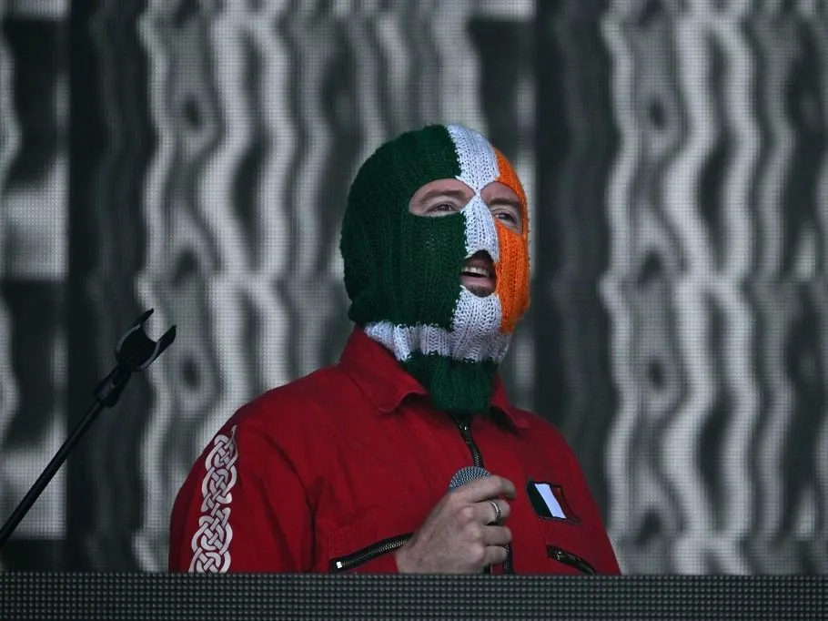 DJ Prova of Irish rap band Kneecap performs at the West Holts stage on the fourth day of the Glastonbury festival at Worthy Farm in the village of Pilton in Somerset, south-west England, on June 28, 2025. (Photo by Oli SCARFF / AFP)