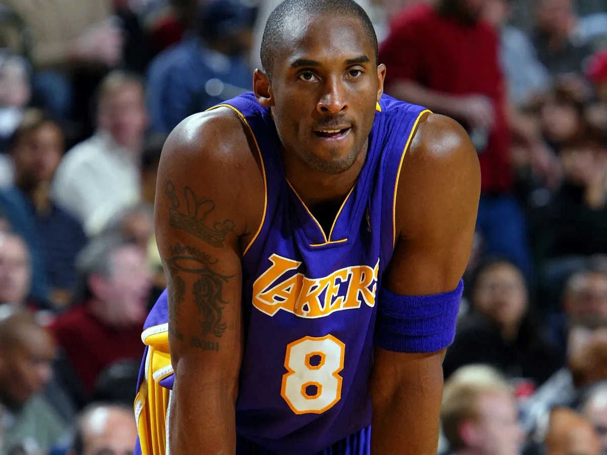 DALLAS - JANUARY 5:  Guard Kobe Bryant #8 of the Los Angeles Lakers pauses during a game against the Dallas Mavericks on January 5, 2005 at the American Airlines Center in Dallas, Texas. NOTE TO USER: User expressly acknowledges and agrees that, by downloading and or using this photograph, User is consenting to the terms and conditions of the Getty Images License Agreement. (Photo by Ronald Martinez/Getty Images)  *** Local Caption *** Kobe Bryant (Photo by Ronald Martinez / Getty Images North America / Getty Images via AFP)