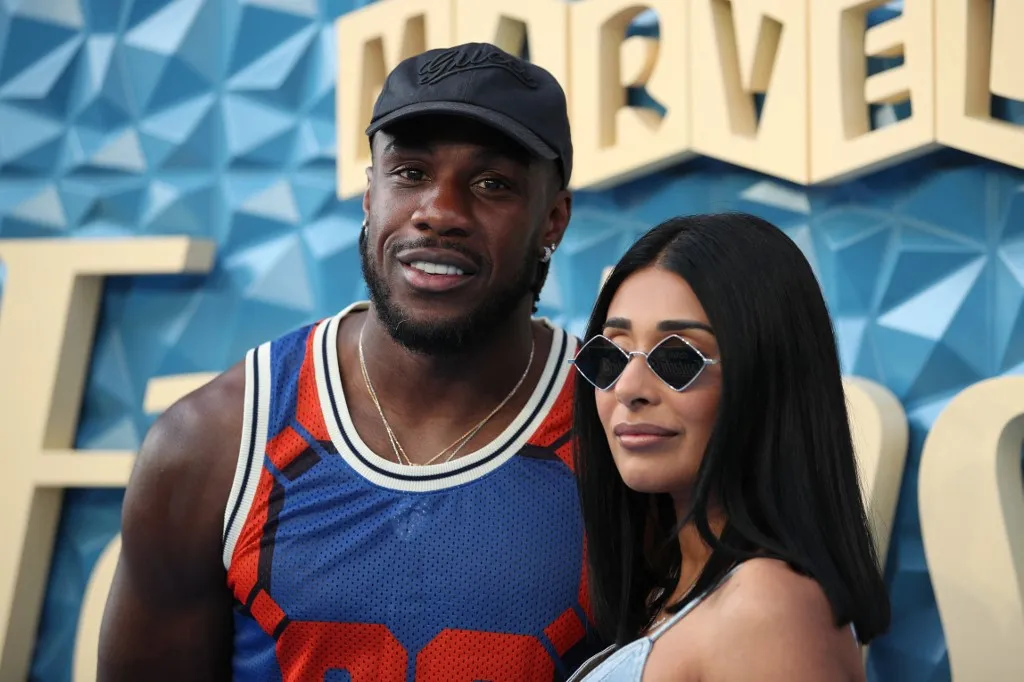 rekorder Footballer Michail Antonio (L) poses on the red carpet upon arrival at a launch event for "The Fantastic Four: First Steps" in central London, on July 10, 2025. (Photo by Rhianna Chadwick / AFP)