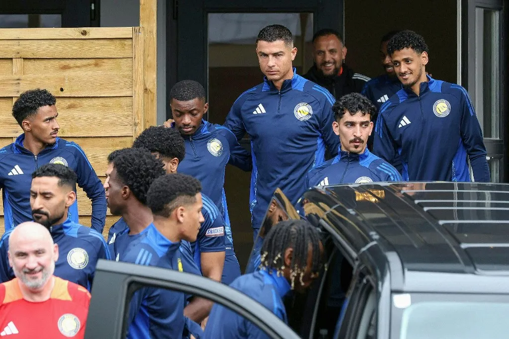 Saudi Pro League football club Al-Nassr's Portuguese forward Cristiano Ronaldo (3rd R) and his teammates are pictured at a team training session in Saalfelden, Austria on July 25, 2025, where the club are based for a training camp. Ronaldo inked a new two-year extension with Saudi Arabia's Al Nassr, the club announced on June 26, following months of speculation over which team he would sign for next season. (Photo by FRANZ NEUMAYR / APA / AFP) / Austria OUT