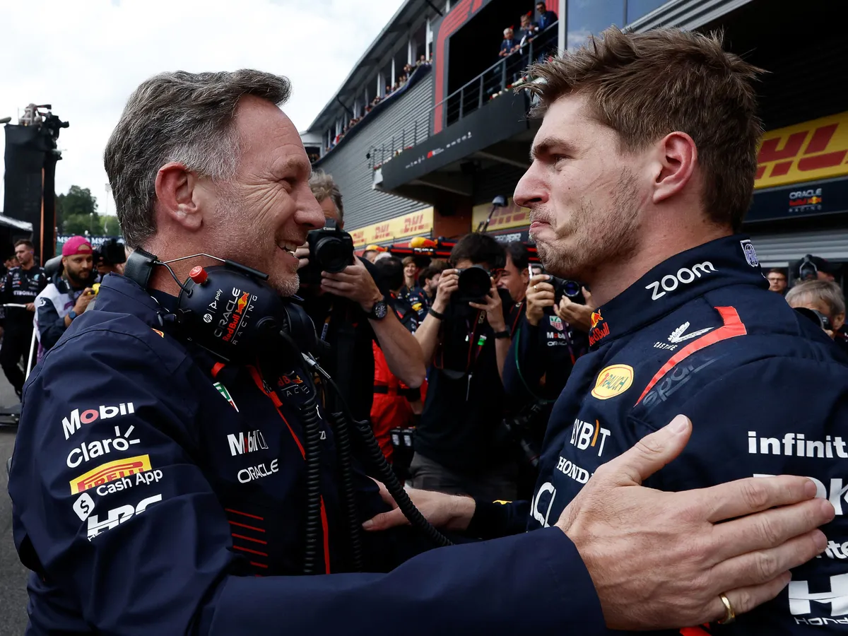 (FILES) Red Bull Racing's Dutch driver Max Verstappen (R) reacts with Red Bull Racing's British team principal Christian Horner   in the parc ferme after winning the Formula One Belgian Grand Prix at the Spa-Francorchamps Circuit in Spa on July 30, 2023. Christian Horner is to leave his role as Red Bull team principal with immediate effect after 20 years, the Formula One team announced on July 9, 2025. (Photo by SIMON WOHLFAHRT / AFP)