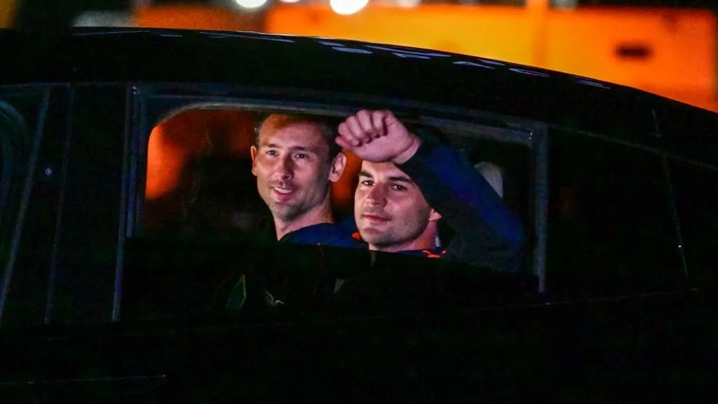 Kapu Tibor, Polish astronaut Slawosz Uznanski-Wisniewski (L) and Hungarian astronaut Tibor Kapu gesture at relatives as he makes his way to Launch Complex 39A ahead of the Axiom-4 mission, with a SpaceX Dragon spacecraft and Falcon 9 rocket, lift off at NASA's Kennedy Space Center in Cape Canaveral, Florida, on June 24, 2025. India, Poland and Hungary are set to send people to space for the first time in decades on an American commercial mission to the International Space Station that blasts off early morning on June 25.Axiom Mission 4, or Ax-4, will launch from NASA's Kennedy Space Center in Florida at 2:31 am (0631 GMT), with a brand-new SpaceX Crew Dragon capsule riding atop a Falcon 9 rocket. (Photo by Giorgio VIERA / AFP)