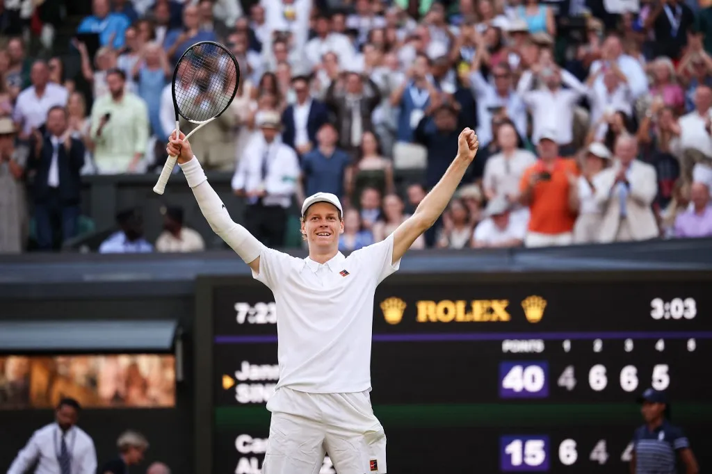 Italy's Jannik Sinner celebrates after victory against Spain's Carlos Alcaraz at the end of their men's singles final tennis match on the fourteenth day of the 2025 Wimbledon Championships at The All England Lawn Tennis and Croquet Club in Wimbledon, southwest London, on July 13, 2025. (Photo by HENRY NICHOLLS / AFP) / RESTRICTED TO EDITORIAL USE