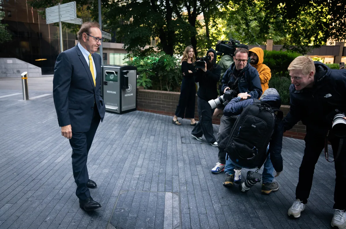 PA REVIEW OF THE YEAR 2023 File photo dated 25/07/23 - A photographer is helped by a colleague after falling as actor Kevin Spacey arrives at Southwark Crown Court, London, where he is charged with three counts of indecent assault, seven counts of sexual assault, one count of causing a person to engage in sexual activity without consent and one count of causing a person to engage in penetrative sexual activity without consent between 2001 and 2005. Issue date: Thursday December 21, 2023.