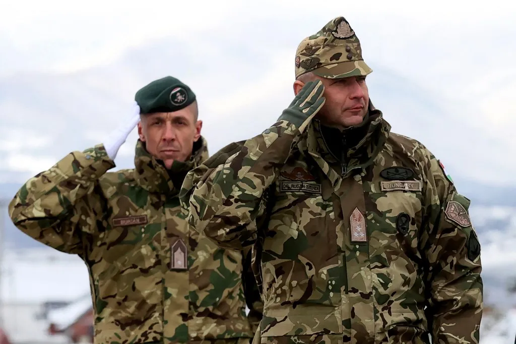 This photo taken on December 13, 2021 shows then Lieutenant General Romulusz Ruszin-Szendi (R) of Hungary as he takes part in a celebration in Pristina, Kosovo. Hungary's top army chief was relieved of his post on April 27, 2023 without explanation, according to a presidential decree, the latest upheaval in the NATO member's armed forces in recent months. Several hundred senior officers and military intelligence officers have reportedly been fired this year as a law adopted by Prime Minister Viktor Orban's government in January allowed the defence minister to sack anyone over the age of 45. While the government says it wants to rejuvenate the armed forces, opposition parties called the personnel cull "purges" aimed at replacing Western-oriented pro-NATO officers. "With effect from April 27, I have dismissed Lieutenant General Romulusz Ruszin-Szendi, the commander of the Hungarian Defense Forces, from his position," said a decree signed by President Katalin Novak in Hungary's official gazette. (Photo by AFP)