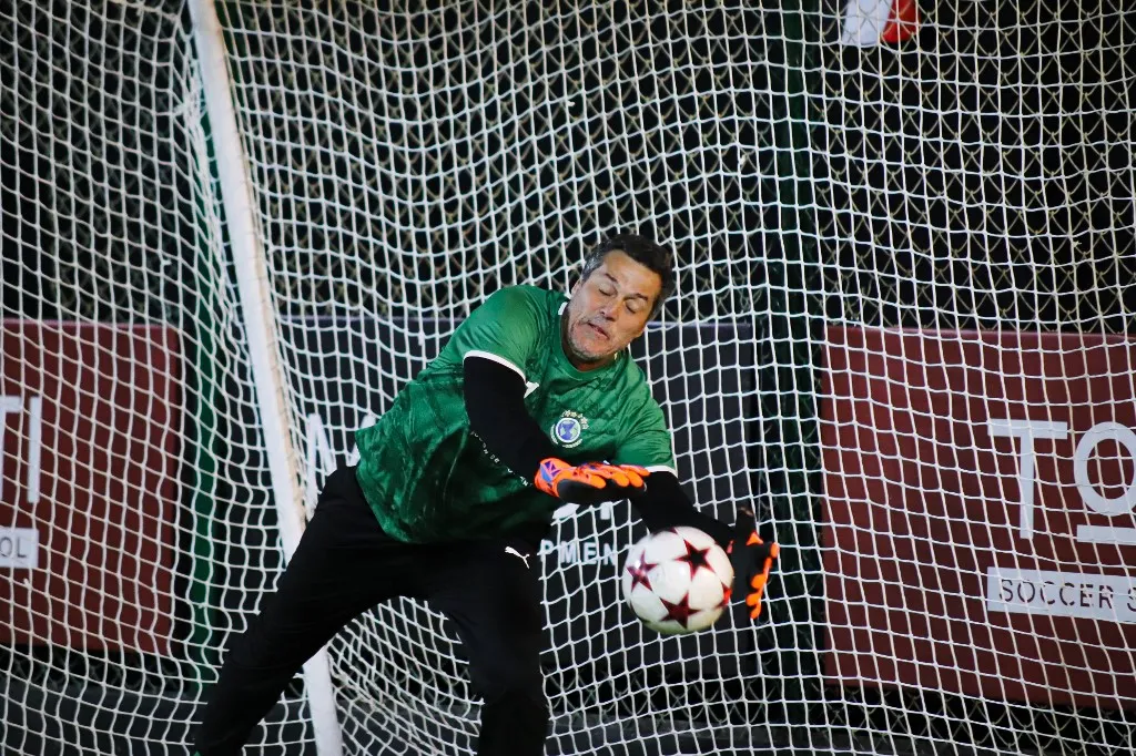 Julio Cesar saves the ball in a friendly match for retired football legends during the opening of the Totti Football Academy in Cairo, Egypt, on February 18, 2025. (Photo by Ahmed Mosaad/NurPhoto) (Photo by Ahmed Mosaad / NurPhoto via AFP)