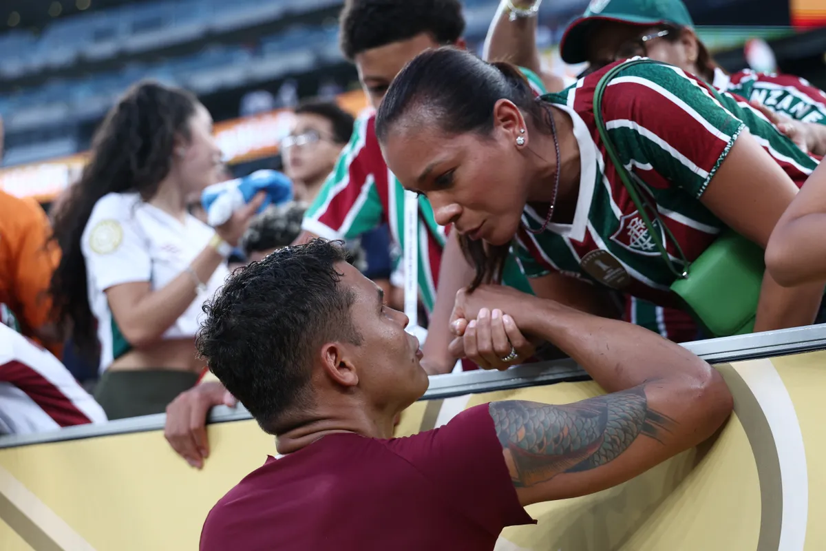 Fluminense's Brazilian defender #03 Thiago Silva greets his wife after winning the FIFA Club World Cup 2025 Group F football match between Brazil's Fluminense and South Korea's Ulsan HD at the MetLife stadium in East Rutherford, New Jersey on June 21, 2025. (Photo by FRANCK FIFE / AFP)