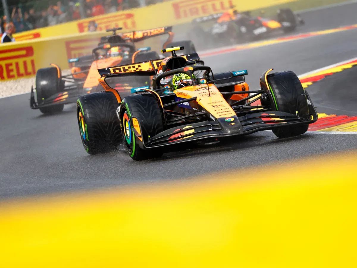 McLaren's British driver Lando Norris drives behind the safety card ahead of the start of the Formula One Belgian Grand Prix at the Spa-Francorchamps circuit in Spa, on July 27, 2025. (Photo by SIMON WOHLFAHRT / AFP)