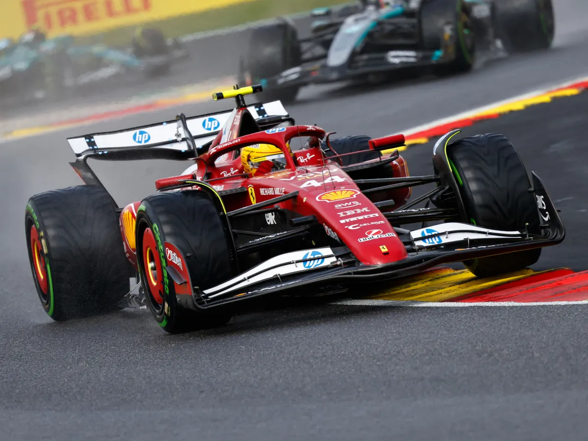 Ferrari's British driver Lewis Hamilton drives behind the safety card ahead of the start of the Formula One Belgian Grand Prix at the Spa-Francorchamps circuit in Spa, on July 27, 2025. (Photo by SIMON WOHLFAHRT / AFP)